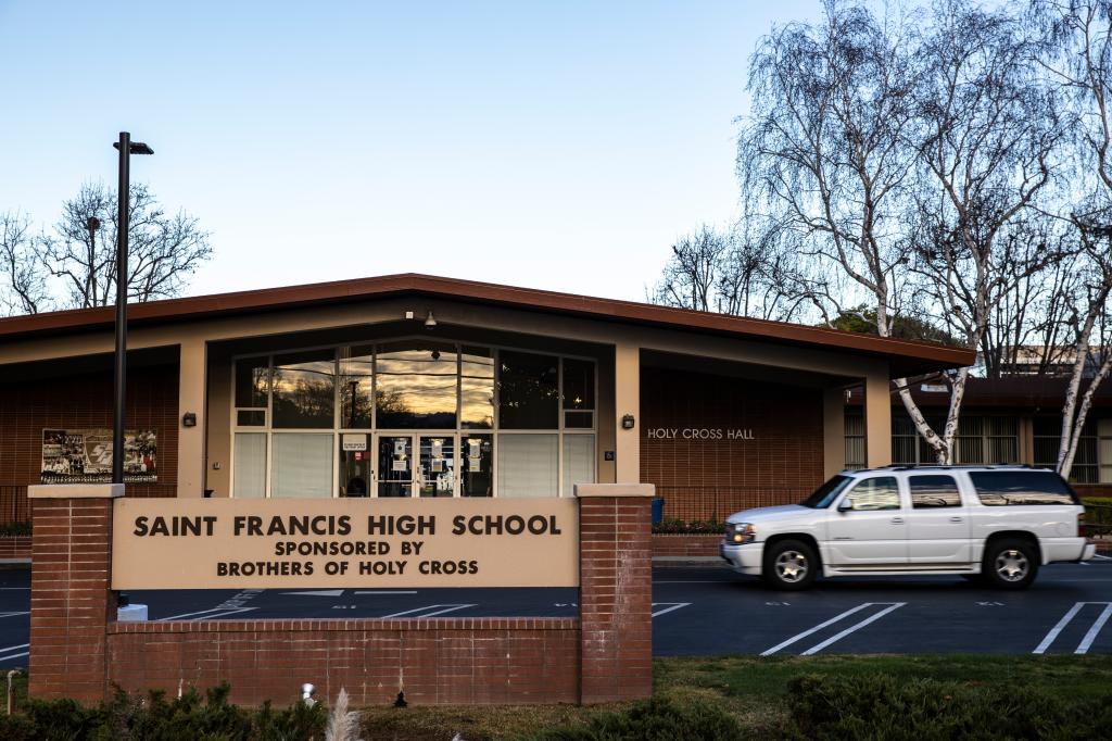Exterior view of St Francis High School in Mountain View, California with a white truck parked in front