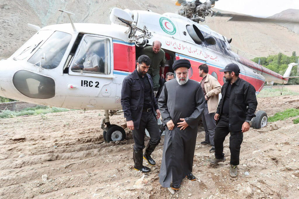 Iranian President Ebrahim Raisi getting off a helicopter.