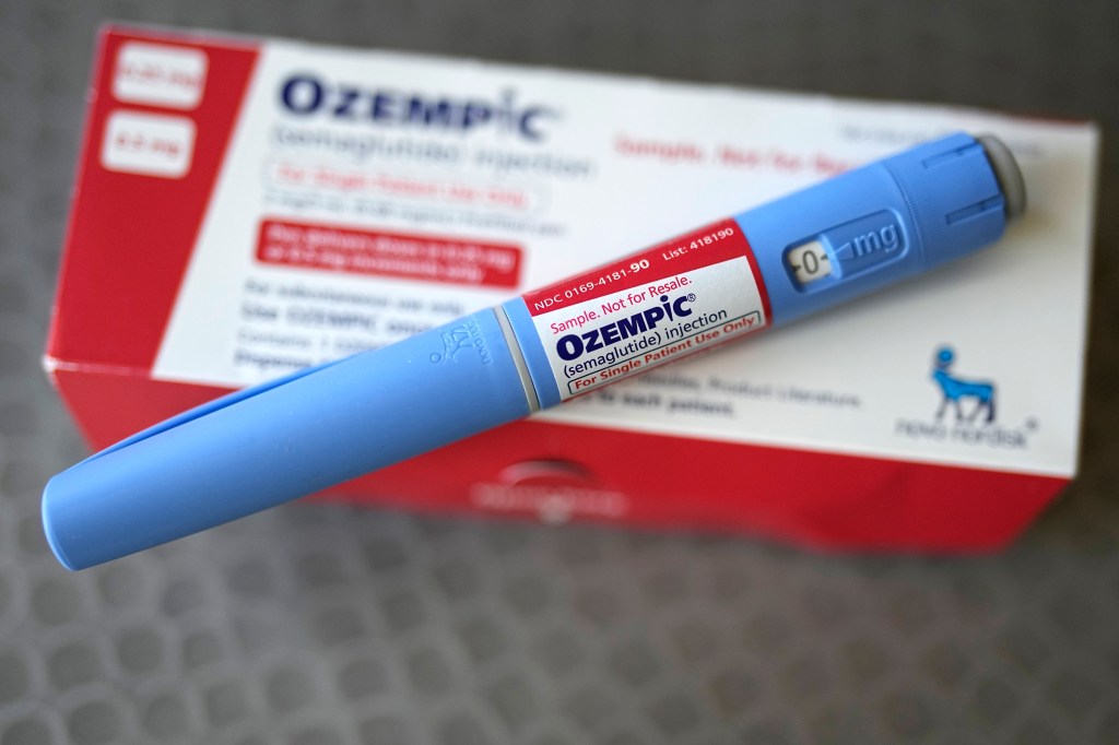 Injectable weight loss drug Ozempic in a box with a blue pen