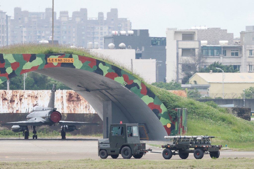 Ground staff members transport missiles near a Taiwan Air Force Mirage 2000-5 aircraft at Hsinchu Air Base, in Hsinchu, Taiwan May 23, 2024
