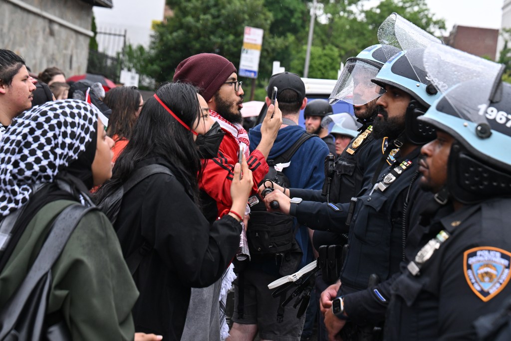 Protesters confront cops. 