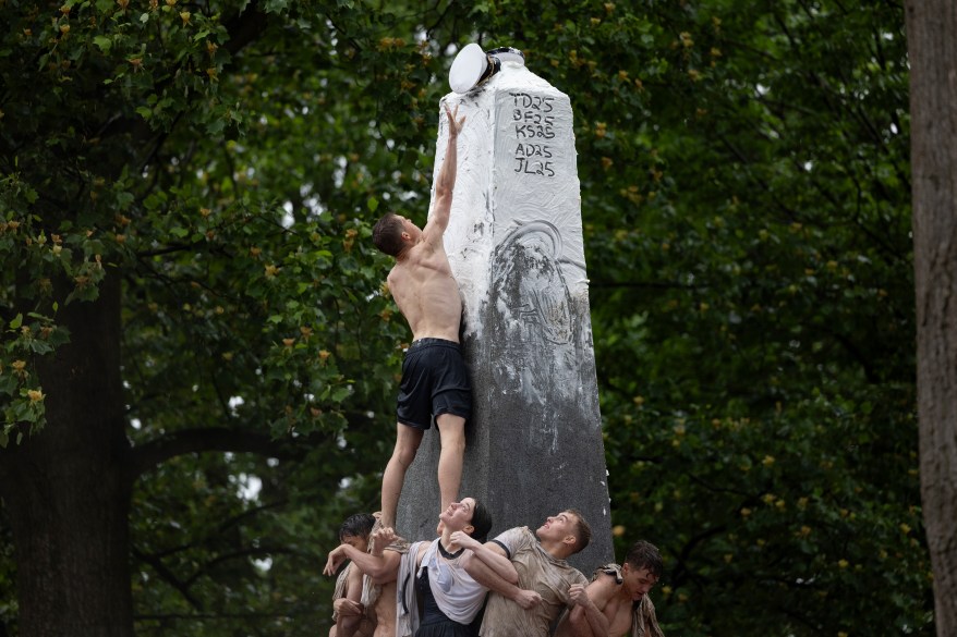 Plebes climb the Herndon Monument at the U.S. Naval Academy, Wednesday, May 15, 2024, in Annapolis, Maryland.