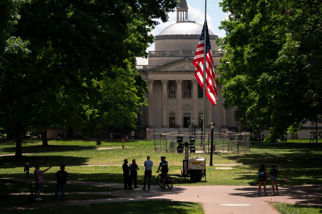 A barricade protects the American flag at Polk Place at the University of North Carolina on May 1, 2024 in Chapel Hill, North Carolina