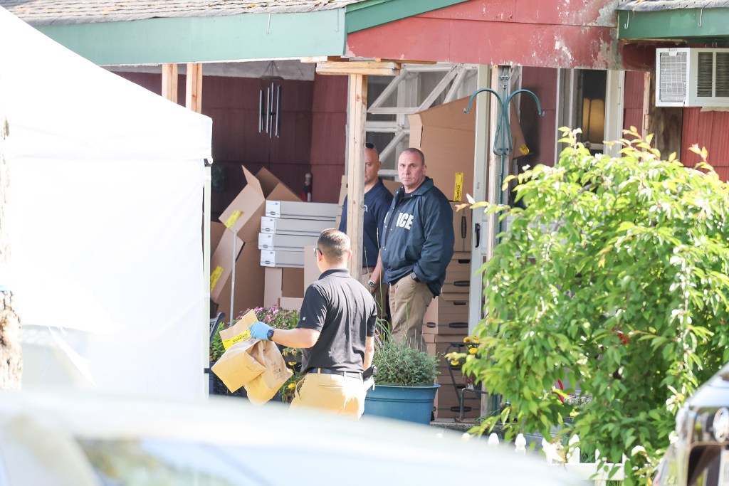 Cops search Heuermann house in Massapequa Park. 