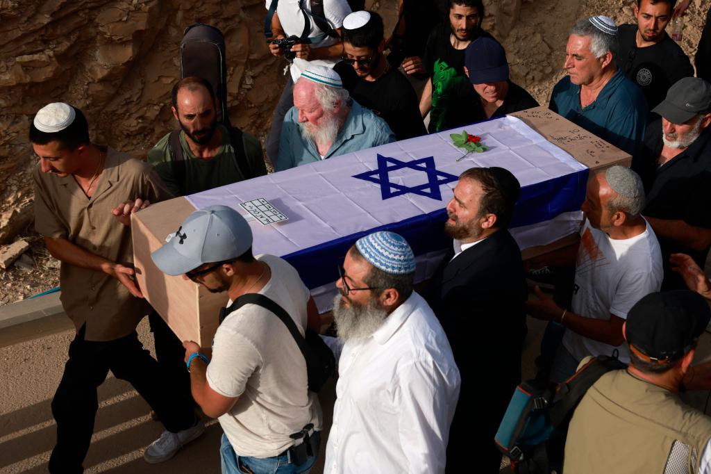 Shani Louk's body was laid to rest Sunday during a public funeral attended by hundreds in Israel