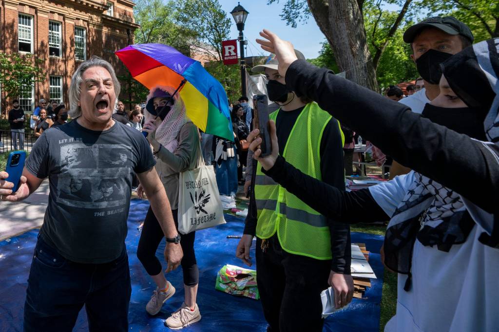 A man walking through campus yells at protesters who were part of a student encampment at Rutgers New Brunswick, N.J. on May 2, 2024. 
