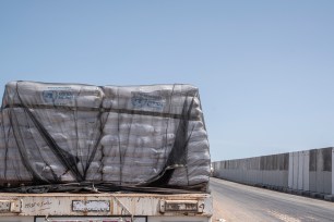 Aid trucks loaded with supplies for Gaza waiting near the Egyptian-Palestinian border