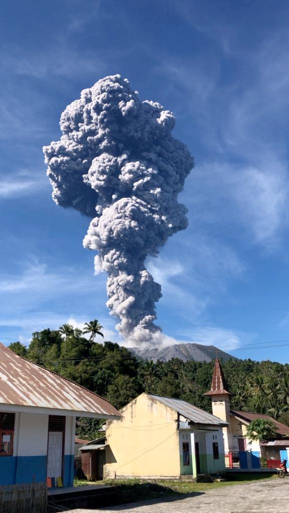 Column of ash rising from the Gunung Ibu volcano in North Maluku province, Indonesia