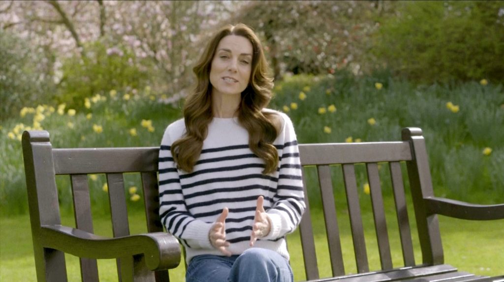 Princess Kate of Wales sitting on a bench, recording her message about her cancer diagnosis and chemotherapy treatment