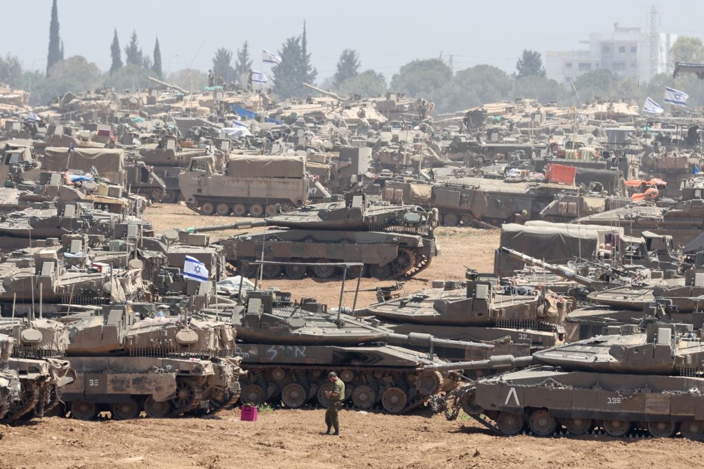 Israeli tanks and soldiers have taken over Rafah crossing and are battling Hamas gunmen in the city outskirts.