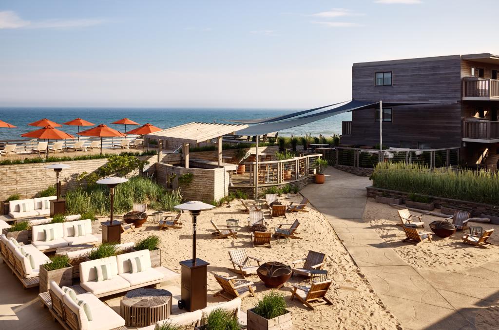 Exterior view of Hampton Hotels - Marram in Montauk featuring a beach with chairs and umbrellas, photo by Read McKendree