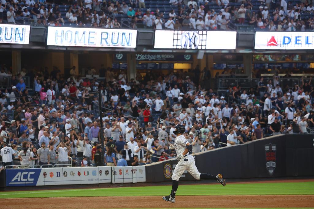 Giancarlo Stanton rounds the bases after his home run against the Astros on Wednesday night.