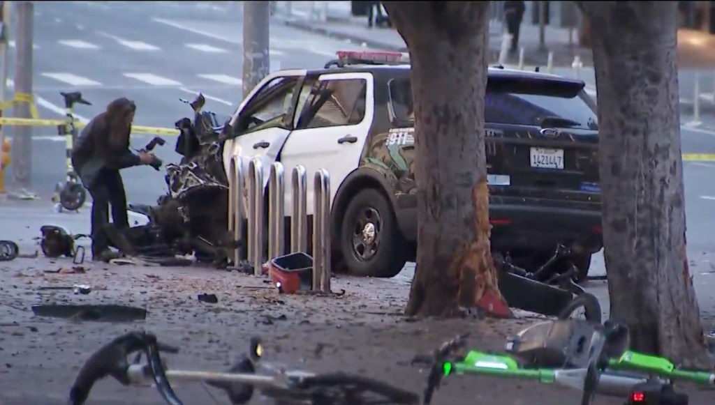 The officer was conducting “security detail” in downtown LA at about 3:30 a.m. on Sunday when the man suddenly jumped into the squad car and attacked her.