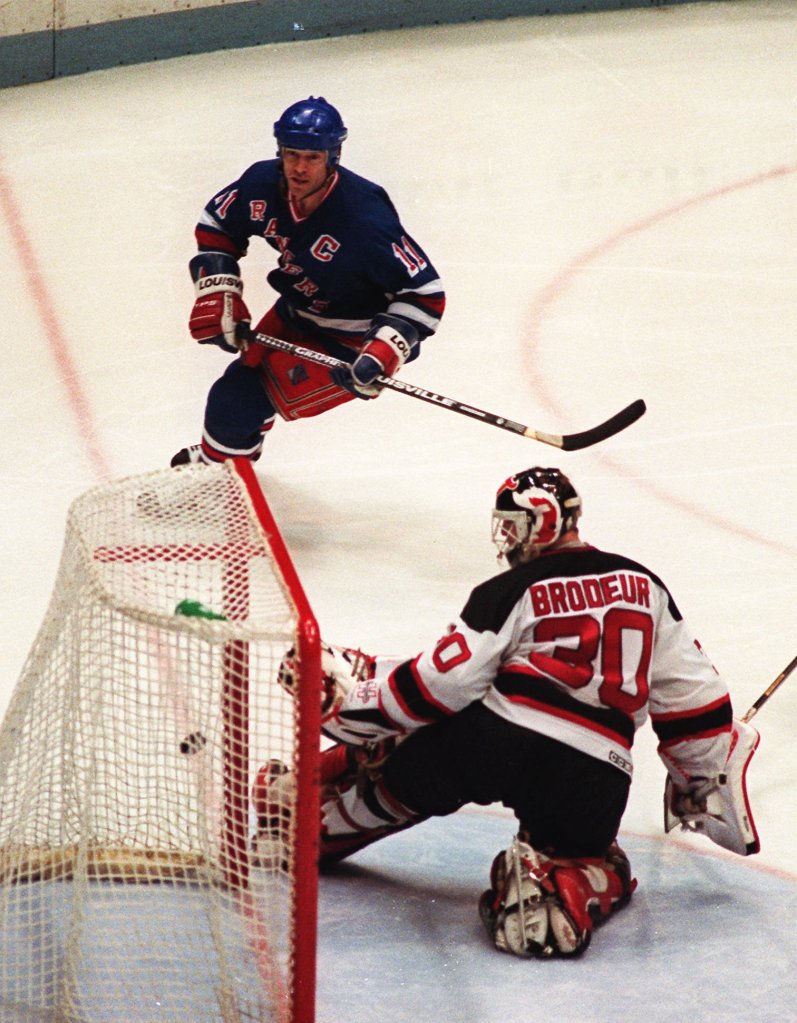 New York Rangers' Mark Messier puts the puck in the net past New Jersey Devils' goaltender Martin Brodeur (30) during the third period at Meadowlands Arena in East Rutherford, N.J., May 25, 1994.