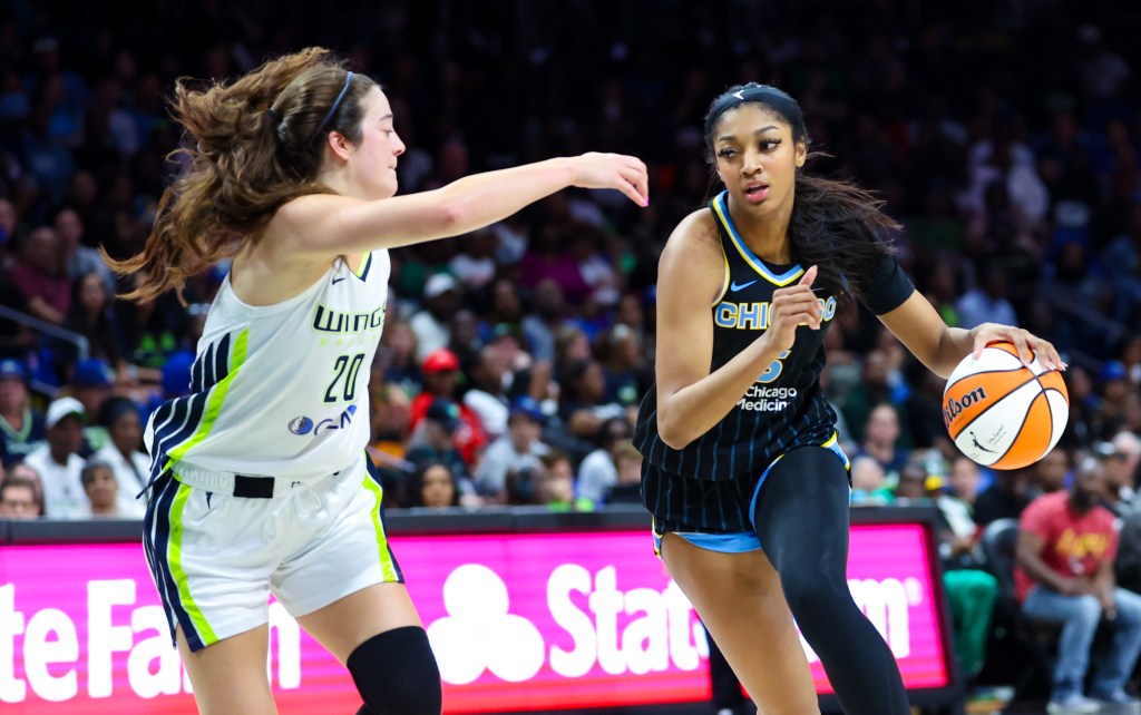 Chicago Sky forward Angel Reese (5) dribbles as Dallas Wings forward Maddy Siegrist (20) defends during the second half  at College Park Center. 