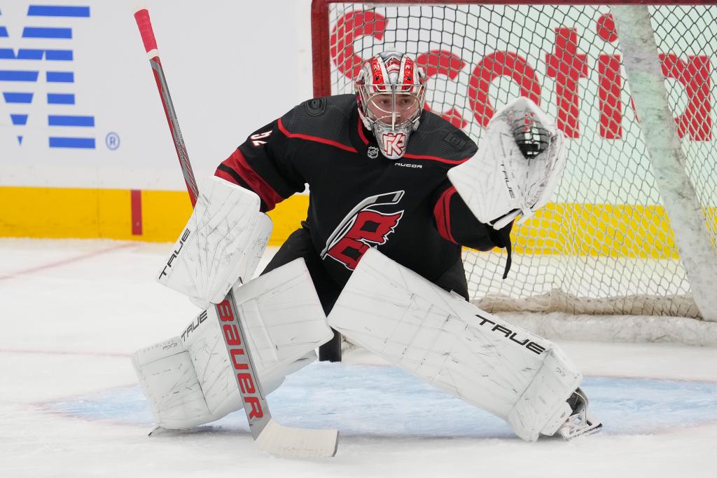 Hurricanes goaltender Pyotr Kochetkov (52) makes a save during warm up