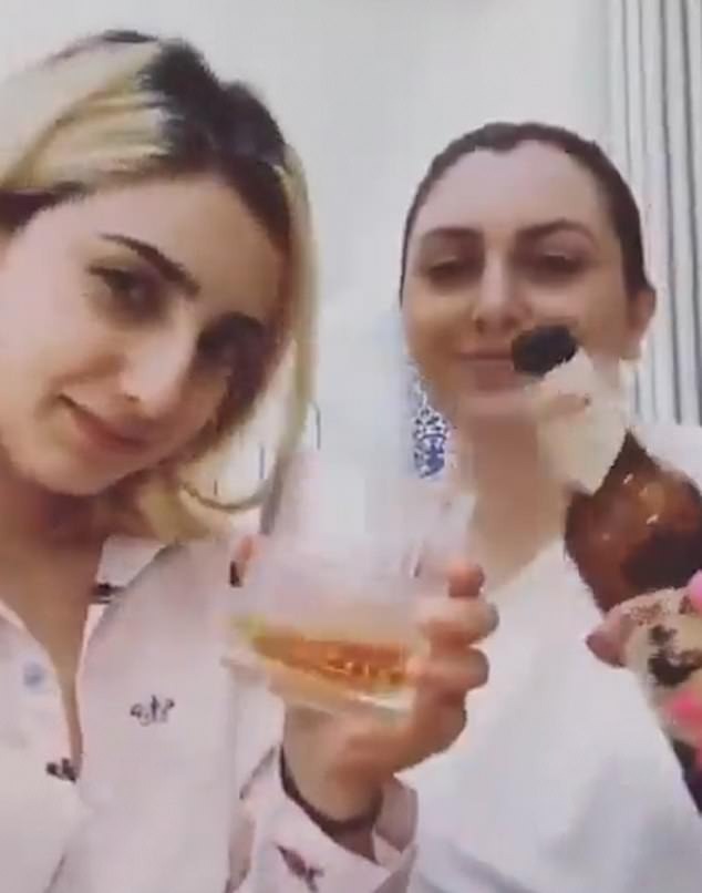 The daughters of Minoo Majidi, a 62-year-old woman killed during Iran's violent 2022 protests, shared a clip of themselves toasting news of Raisi's death.