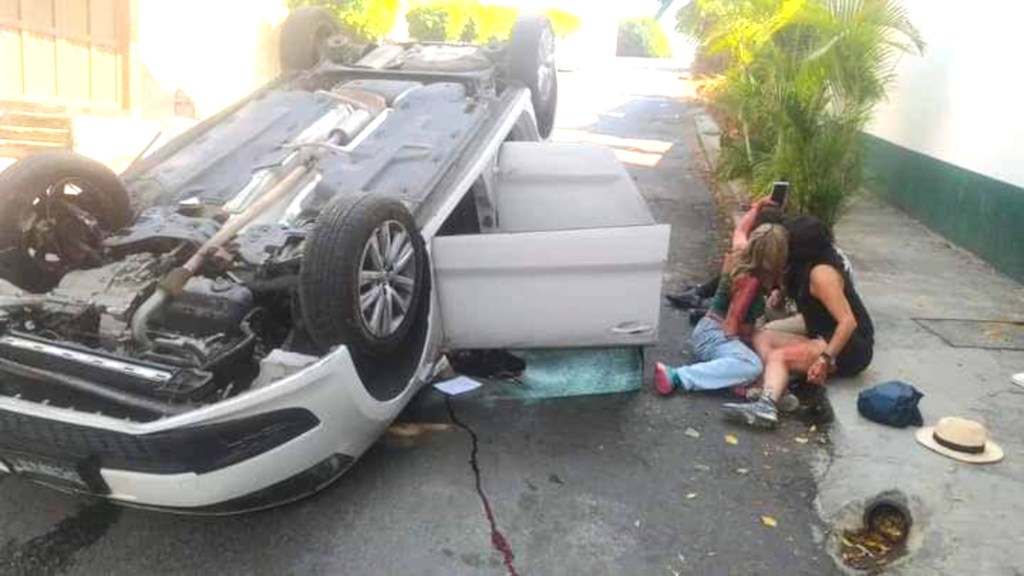 A pair of women left bloodied by a car crash in Mexico posed for a selfie just inches from the wreckage.