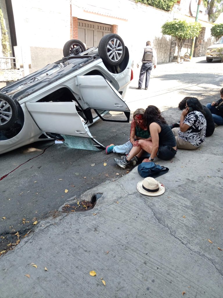 Bloodied victims of the crash waited along the side of the road in Cuernavaca's Lomas del Mirador neighborhood.