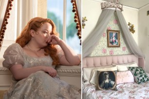 A woman sitting in a room with a bed and a picture of Marie Antoinette