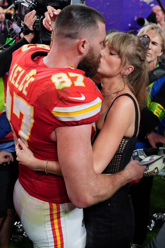 Travis Kelce and Taylor Swift kiss  after the Chiefs beat the 49ers in the Super Bowl at Allegiant Stadium on February 11, 2024 in Las Vegas, Nevada.  