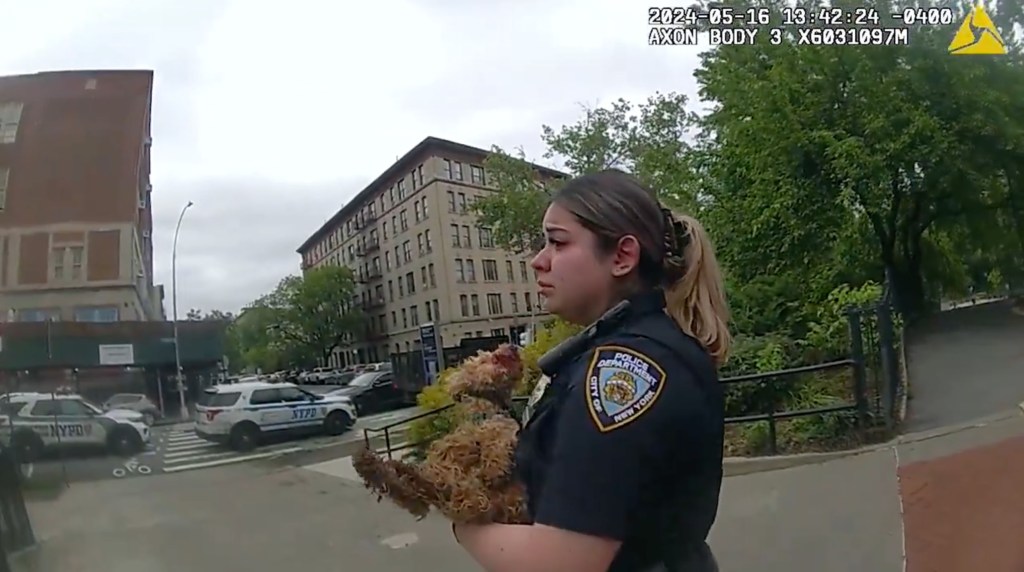 NYPD Officer Kelsey Garcia swooped the tiny bleeding dog into her arms, bodycam footage shows.