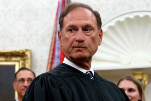 Supreme Court Justice Samuel Alito pauses after swearing in Mark Esper as Secretary of Defense during a ceremony with President Donald Trump in the Oval Office at the White House in Washington, July 23, 2019.