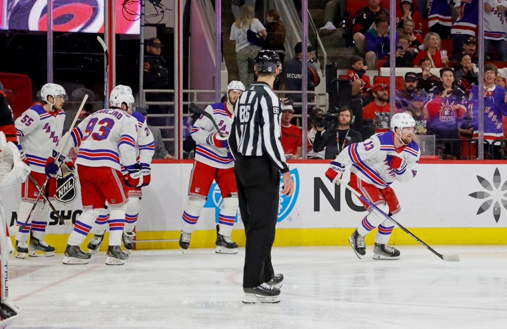 Alexis Lafreniere skates off the ice after celebrating with his teammates following his third period goal during the Rangers' 4-3 loss to the Hurricanes in Game 4.