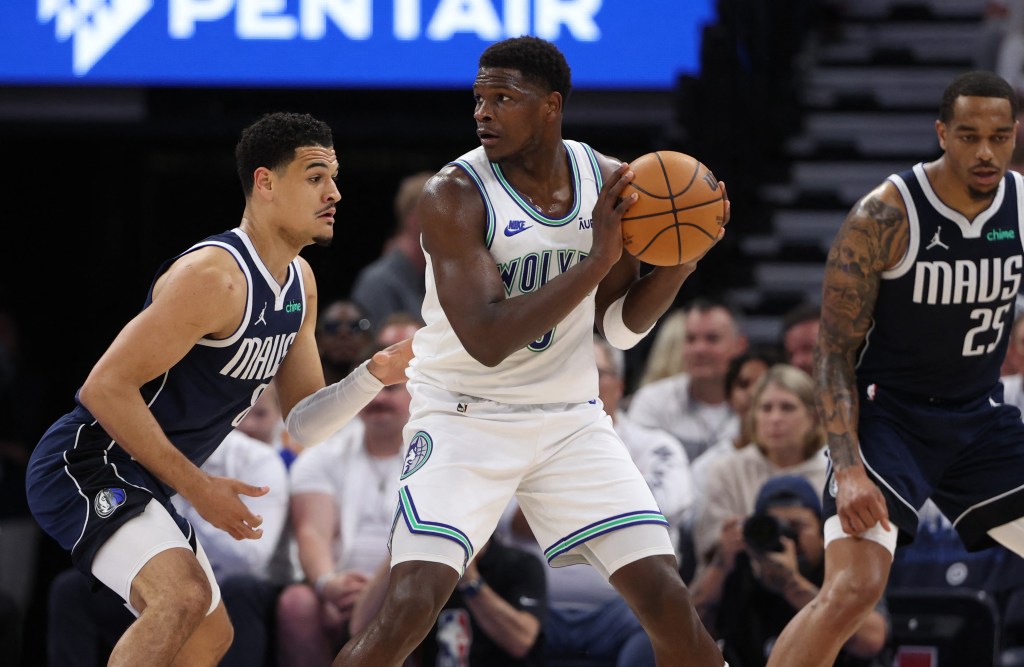 Anthony Edwards, who scored 19 points, looks to make a move on Josh Green during the Timberwolves' loss.