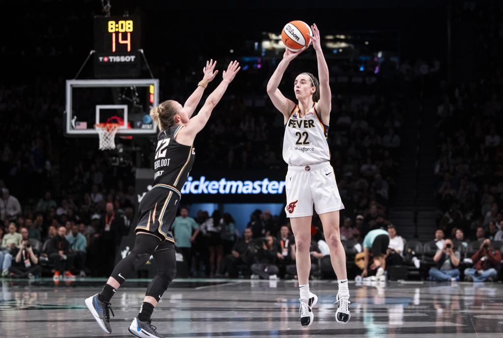 Caitlin Clark, who scored 22 points, shoots over Courtney Vandersloot during the Fever's loss.