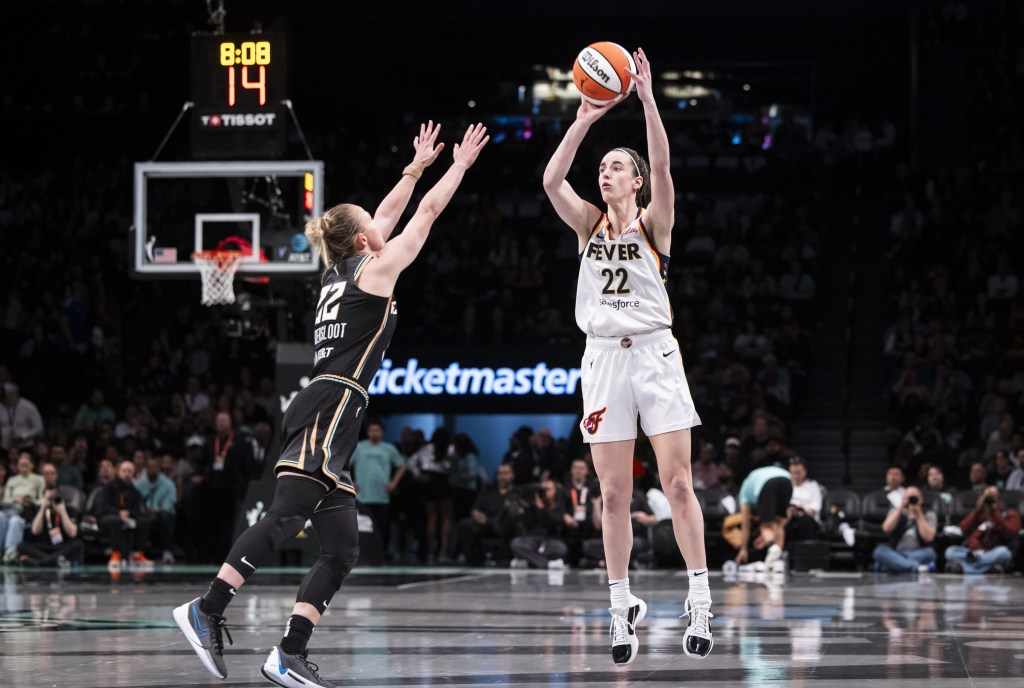 Caitlin Clark, who scored 22 points, shoots over Courtney Vandersloot during the Fever's loss.