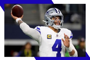 Dallas Cowboys quarterback Dak Prescott drops back to throw a pass.