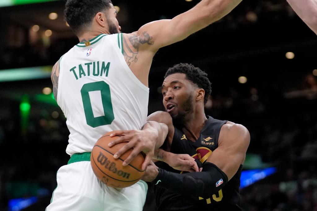 Donovan Mitchell looks to make a pass around Jayson Tatum during the Cavaliers' Game 2 victory.