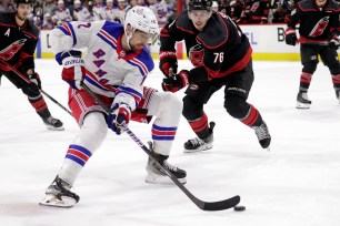 Filip Chytil looks to keep puck away from Brady Skjei during the Rangers' 3-2 Game 3 overtime win over the Hurricanes.