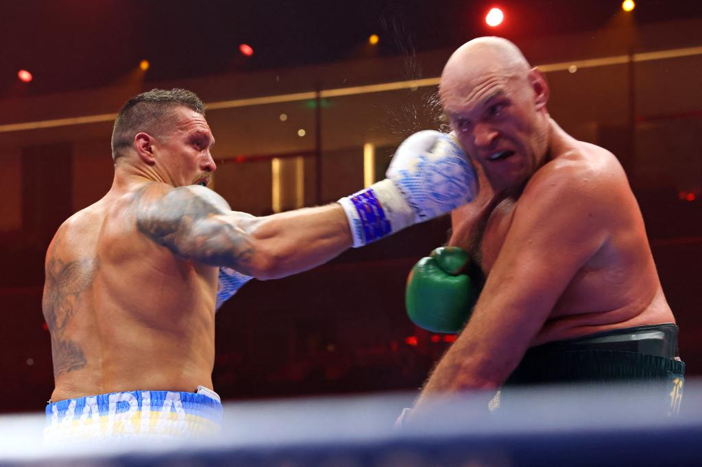 Ukraine's Oleksandr Usyk (L) fights against Britain's Tyson Fury during a heavyweight boxing world championship fight at Kingdom Arena in Riyadh, Saudi Arabia on May 19, 2024. Oleksandr Usyk beat Tyson Fury by split decision to win the world's first undisputed heavyweight championship in 25 years on May 19, 2024, an unprecedented feat in boxing's four-belt era. 