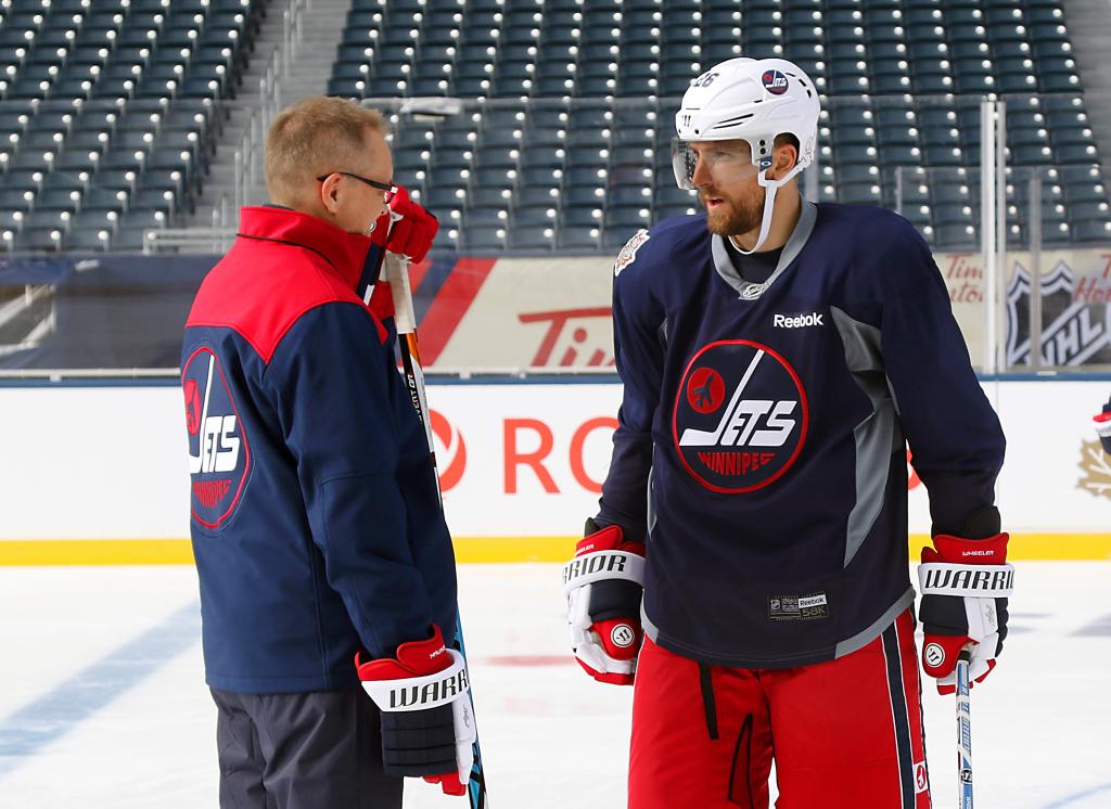Paul Maurice speaks with Blake Wheeler during the practice session in advance the 2016 Tim Hortons Heritage Classic against the Edmonton Oilers on October 22, 2016.