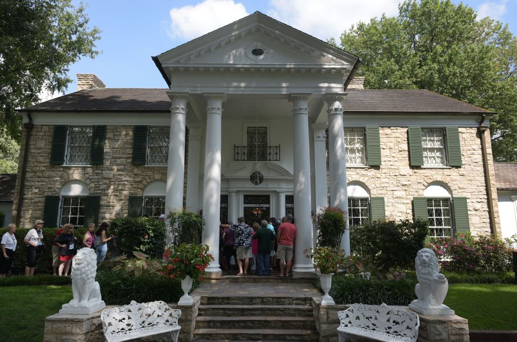 Visitors queue to enter the Graceland mansion.