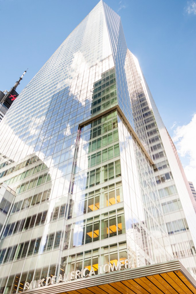 Bank of America Tower at One Bryant Park on West 42nd Street, Manhattan, New York City against a blue sky.