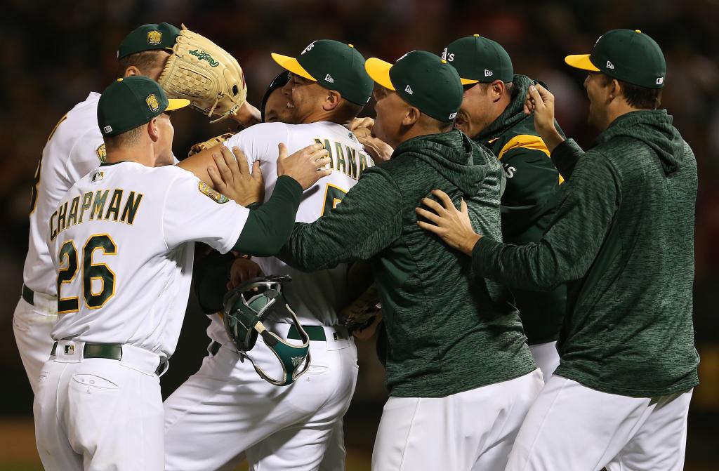 OAKLAND, CA - APRIL 21: Oakland's Sean Manaea is mobbed by teammates following the final out of his 10 strikeout No-Hitter April 21, 2018 against the Boston Red Sox at the Oakland Coliseum. (Photo by Daniel Gluskoter/Icon Sportswire via Getty Images)