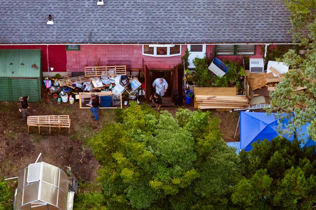 Crime scene investigators examine the basement in the back yard of the home of Gilgo Beach murders suspect Rex Heuermann on Saturday, July 22, 2023.