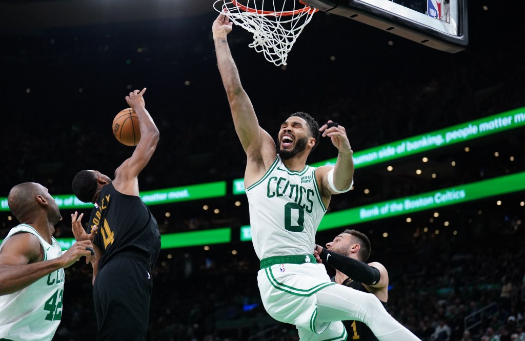 Jayson Tatum, who scored 25 points, has the ball stripped away from him while going up for a dunk during the Celtics' Game 2 loss.