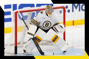 Boston Bruins goalie Jeremy Swayman gets in position.