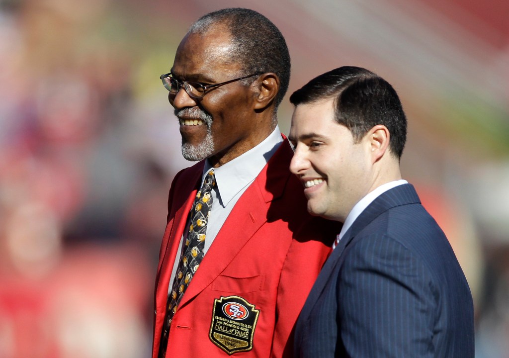 Hall of famer Jimmy Johnson, who died at age 86, is honored by 49ers' owner Jed York before their game against the Rams in 2011.