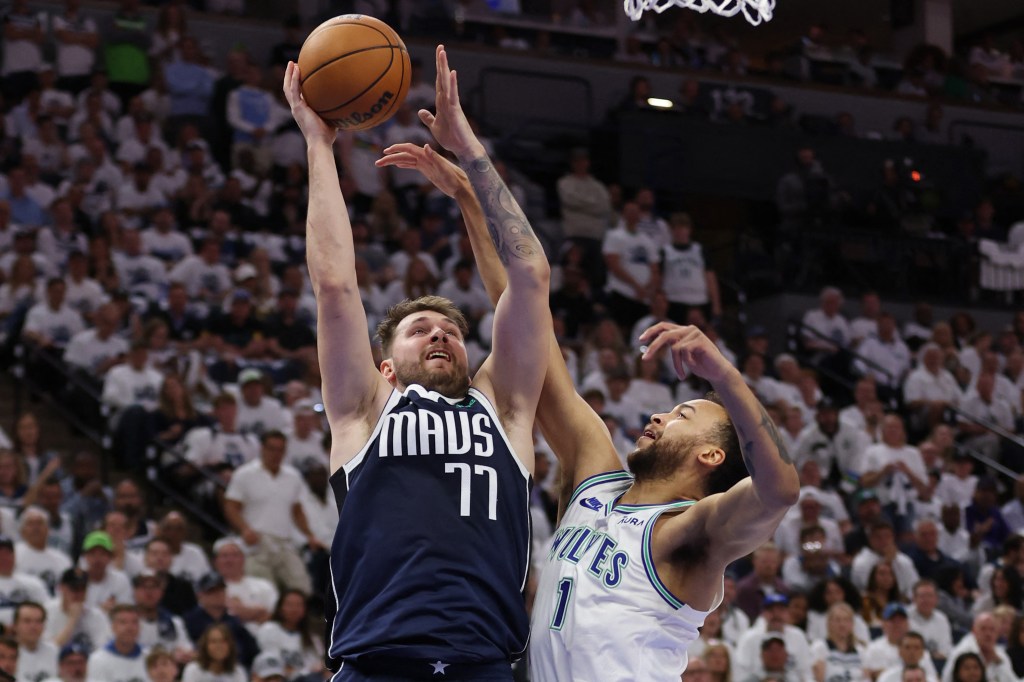 Luka Doncic, who scored 33 points, shoots over Kyle Anderson during the Mavericks' 108-105 Game 1 win over the Timberwolves.