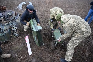 Deminers of the charitable fund 'Demining of Ukraine' use a demining drone to search for mines in the field near the town of Derhachi, Kharkiv region