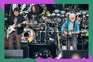 Dead and Co. members John Mayer (L) and Bobby Weir jam out onstage.