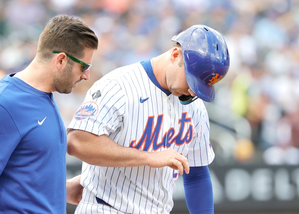 New York Mets first baseman Pete Alonso looks at his hand after he injures it during an at bat in the first inning at Citi Field in Queens