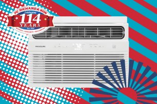 A white air conditioner with red and blue stripes on sale at PC Richard and Sons for Memorial Day