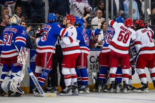 Rangers and Hurricanes players get into a scuffle after Igor Shesterkin was taken out by Andrei Svechnikov in the firs period of the Rangers' Game 2 4-3 win over the Hurricanes in double overtime.