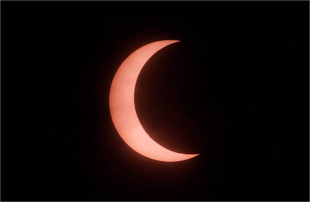 This view of a partial solar eclipse from 1994 made through a telescope with a safe solar filter.